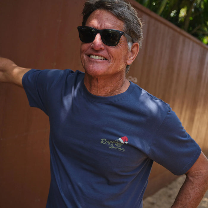 Reyn Spooner Santa Hula Graphic Tee Shirt Sleeve 100% Cotton on a model crewneck Navy shirt front view