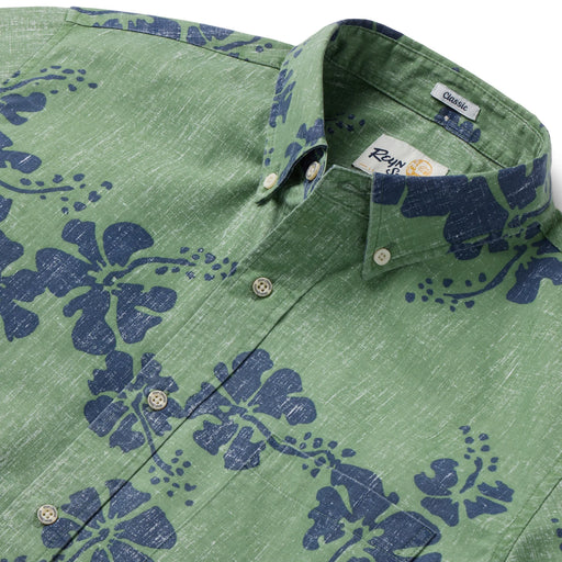 Hawai'i 50th State Flower aloha  button up collared short sleeve jade shirt color with blue hibiscus flowers.