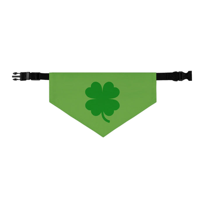 Green bandana with darker green four leaf clover or shamrock emblazoned on front with plastic clasp attaching to the neck