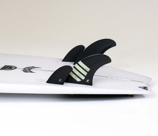Futures Fins TW1 Alpha Canard Pair - 9 Degree Two Fin Set made in the USA shown installed on a surfboard with other fins.