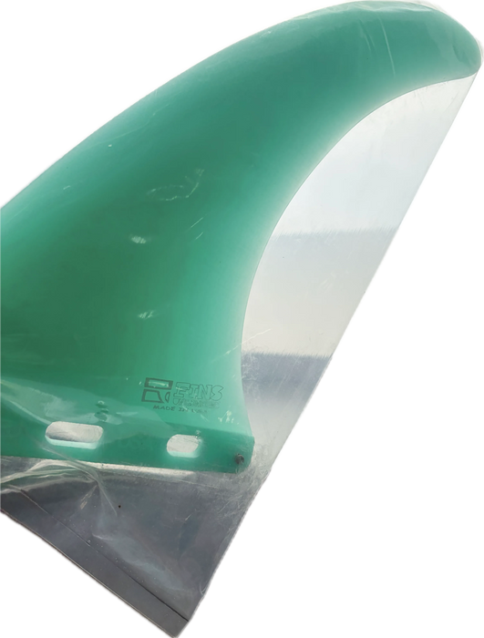 10" Green Tint Kanoa Dahlin Fins Unlimited Fiberglass Longboard Surfboard Fin held up to the light.