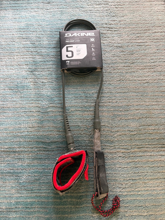 Dakine branded KAIMANA 5' x 3/16" black & red Surfboard Leash including a urethane cord, a molded neoprene cuff and rail saver.