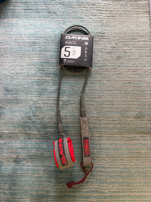 Dakine branded KAIMANA 5' x 3/16" red, grey & black Surfboard Leash including a urethane cord, a molded neoprene cuff and rail saver.