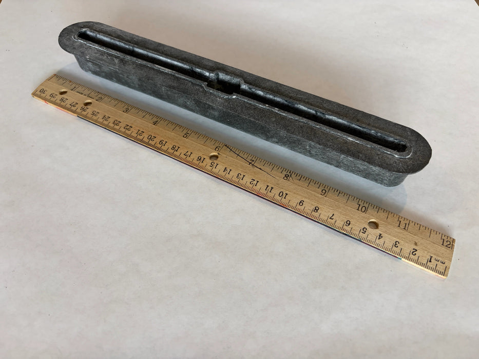 Bahne SUP fin box in black side angle view with a ruler to understand the length of this box.