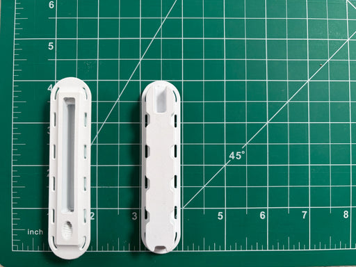Two Futures Fins Twinzer Canard white fin boxes top on the left and  bottom view on the right on a grid to see dimensions.
