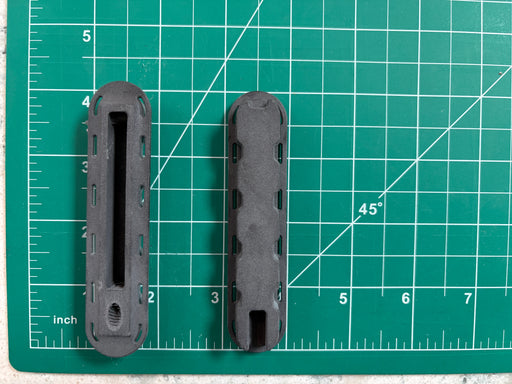 Two Futures Fins Twinzer Canard black fin boxes top on the left and  bottom view on the right on a grid to see dimensions.