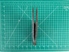 used Bahne Box base 4 3/8" twin fin set in black fiberglass demonstrating the fins cant or outward angle.