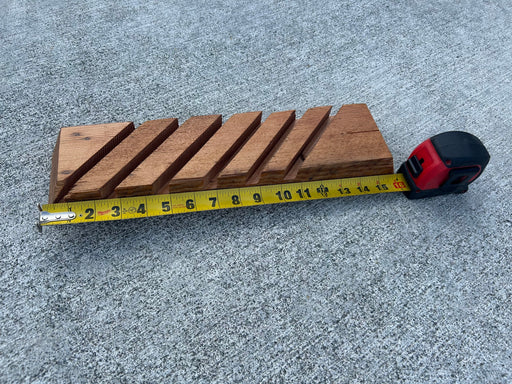 16" repurposed wood with grooves to display 6 surfing fins