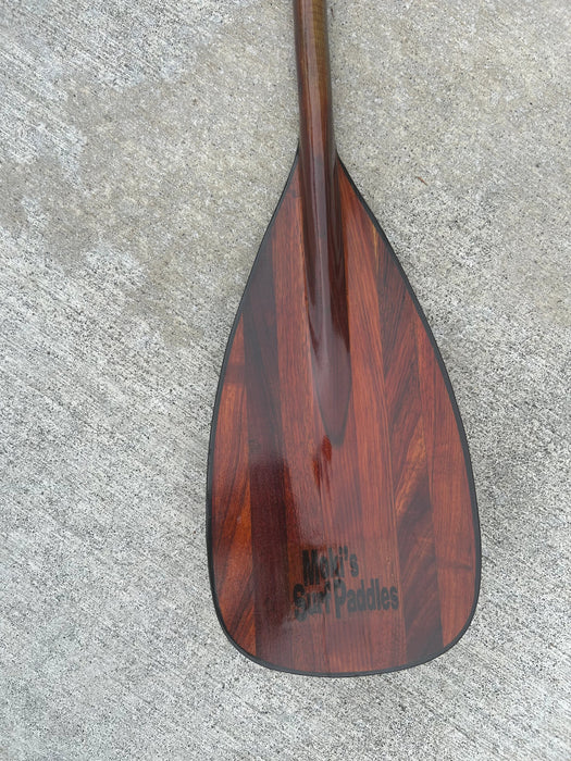 Hawaii grown Koa standup paddle blade with a cut to fit shaft front of blade