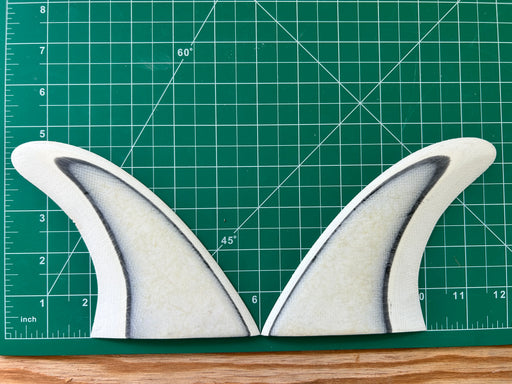 4 5/8" Layered White Black White opaque fiberglass used glass on twin fins on a green grid