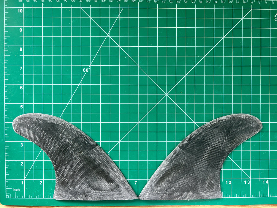 4 1/2" black opaque used fiberglass glass on twin fins, side bites or half a quad set on a green grid 