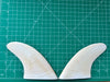 4 1/4" white opaque used fiberglass glass on twin fins, side bites or half a quad set on a green grid 
