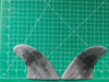 3 7/8" used black opaque fiberglass glass on twin fins, side bites or half a quad set on a green grid 