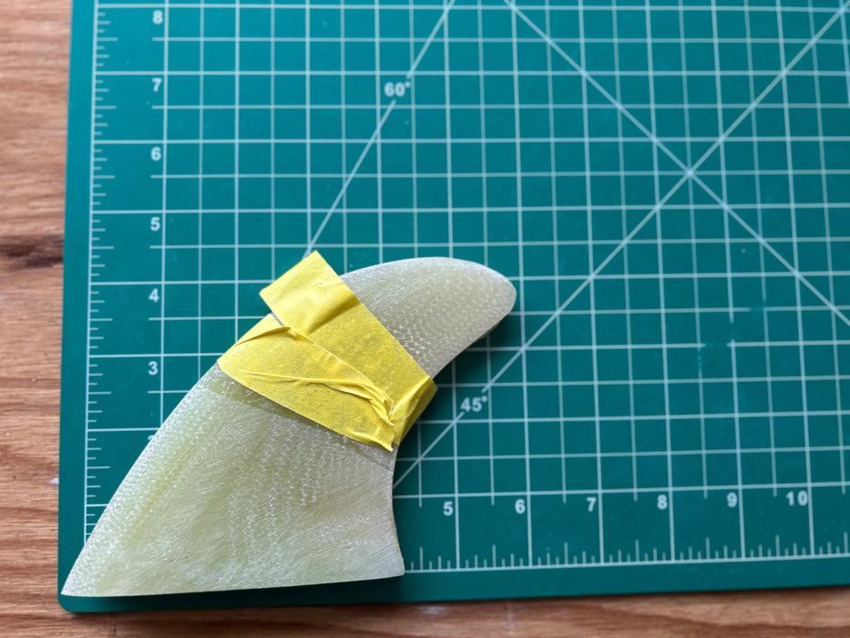 Three translucent yellow used glass on fins stacked one on top of each other