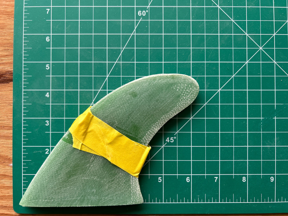 Three translucent green used glass on fins stacked one on top of each other