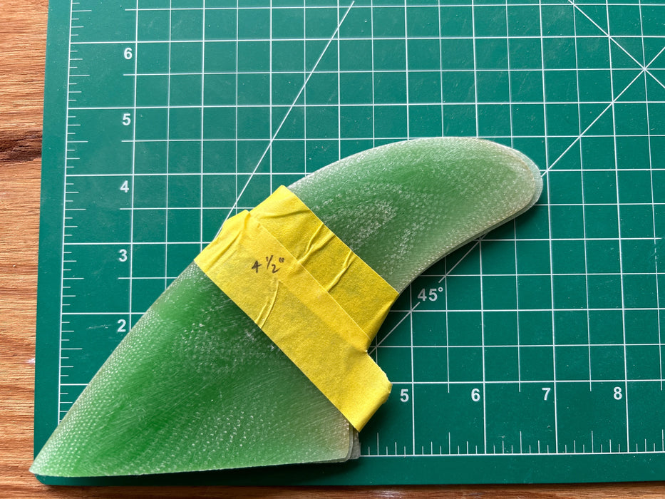 Three green translucent used glass on fins stacked one on top of each other