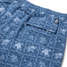 Lahaina Sailor Draw String red swim trunks with the Hawaii flag, flowers and nene back pocket zoom in.