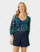 Phoebe Top in the Loulu Fronds print is a relaxed fit button front blouse with a scoop neckline finished with self fabric binding front view tucked in.