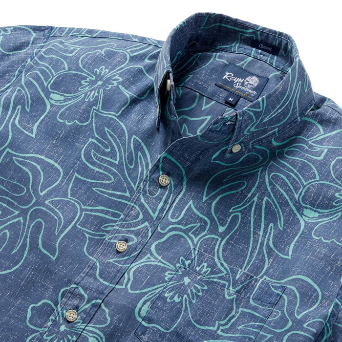 Reyn Spooner DressBlues Monstera Ink  Collared Shirt zoom in monstera, a broad tropical leaf, & hibiscus, the Hawai'i state flower