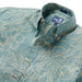 Reyn Spooner Sagebrush Monstera Ink  Collared Shirt zoom in monstera, a broad tropical leaf, & hibiscus, the Hawai'i state flower