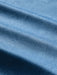 Close-up of a blue quarter-zip pullover with a subtle white line Tapa pattern of waves surfboards and and other Hawaiian elements; Reyn Spooner label inside the collar.
