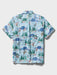 Light blue collared buttoned up Aloha shirt featuring Looney Tunes cartoon characters Bugs Bunny, Sylvester and many others back view.