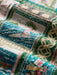 Super zoom in on a scene of Father Christmas wearing a fresh palm front open top hat called a papale niu piko'ole, on a surfboard riding a wave.