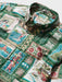 Hawaiian Christmas 2026 long sleeve button front, matched pocket with richly detailed print zoomed in on classic Hawaii scenes and quilt patterns.