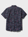 Surfin' Santa Performance Button Front Collared Short Sleeve Charcoal colored Aloha Shirt depicts Santa Surfing Waikiki with Diamondhead in the background back view.
