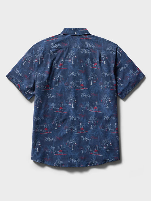 Surfin' Santa Performance Button Front Collared Short Sleeve Navy colored Aloha Shirt depicts Santa Surfing Waikiki with Diamondhead in the background back view.