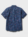 Surfin' Santa Performance Button Front Collared Short Sleeve Navy colored Aloha Shirt depicts Santa Surfing Waikiki with Diamondhead in the background back view.