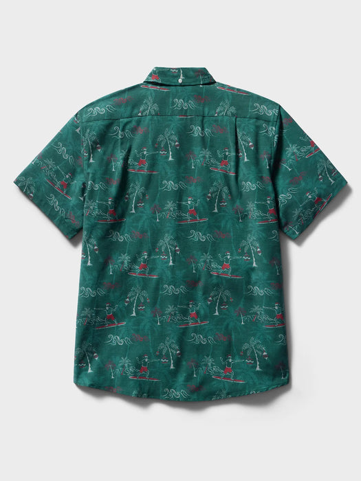 Surfin' Santa Performance Button Front Collared Short Sleeve Pine colored Aloha Shirt depicts Santa Surfing Waikiki with Diamondhead in the background back view.