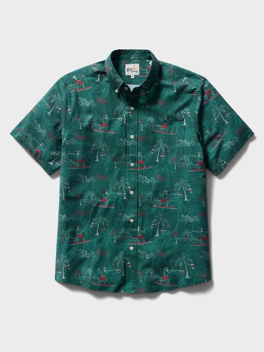 Surfin' Santa Performance Button Front Collared Short Sleeve Pine colored Aloha Shirt depicts Santa Surfing Waikiki with Diamondhead in the background front view.