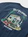Reyn Spooner Navy Blue T-Shirt back view with Mele Kalikimaka and Santa chillin' at his surf shack with dog, Christmas decorated palms and two surfboards.