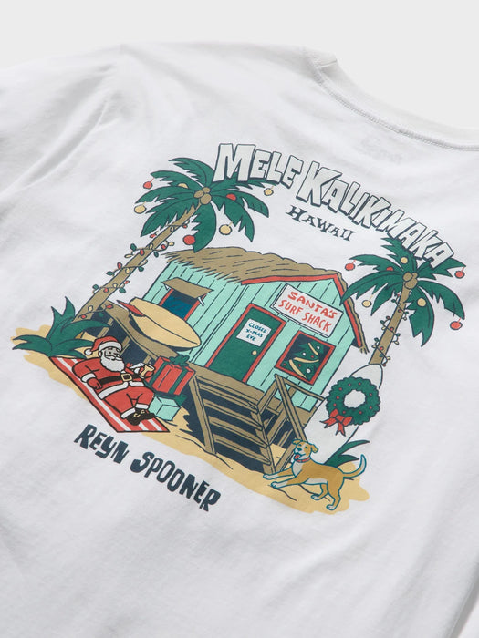 Reyn Spooner White T-Shirt back view with Mele Kalikimaka and Santa chillin' at his surf shack with dog, Christmas decorated palms and two surfboards.