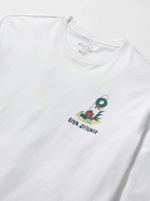 A close-up of a white long-sleeve t-shirt with a small graphic on the left chest showing a surfboard with wrapped presents and the text 'REYN SPOONER'.