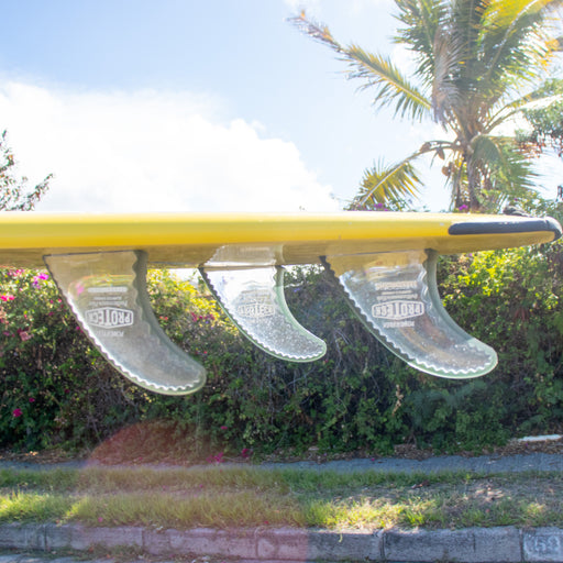 Power Flex is a thruster Pro Teck Fin with a medium core flex on the beach in the sand