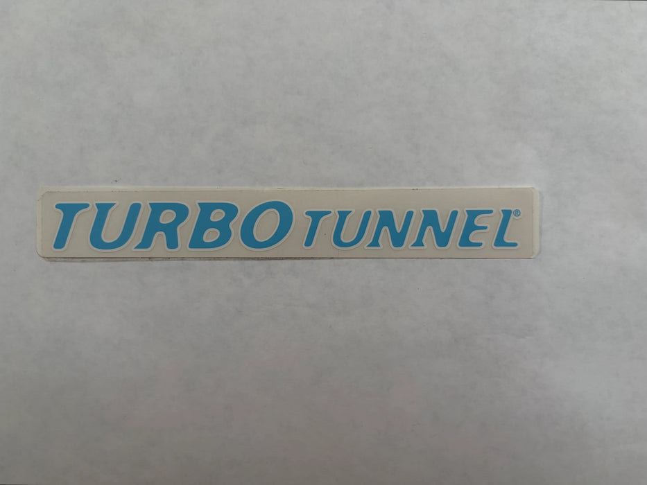 A rectangular clear sticker or decal with the words 'TURBO TUNNEL' in blue lettering boarded in white.
