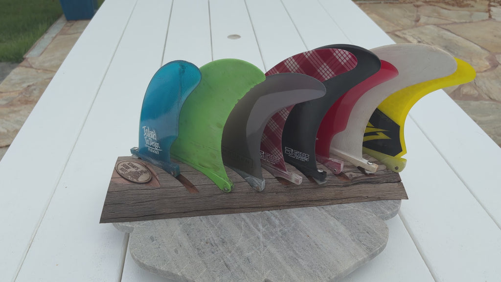 clear coated curved ohia wood 8 surfboard fin slot display with fins